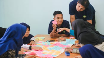 A team working together with postit notes