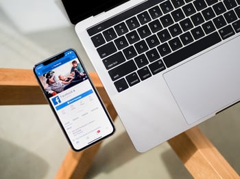 Facebook on phone on a clear desk