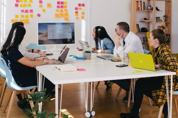 Group of people sitting at desk-1