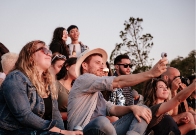 Crowd of people recording a concert