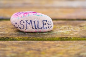 Smile | Image in blog: How to Create a Culture Based on Happiness