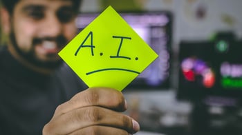 Someone with post it that says AI
