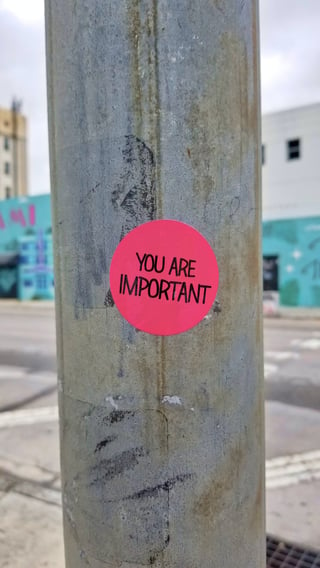 Sticker on a pole that says you are important-1