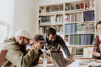 Three people working in an office