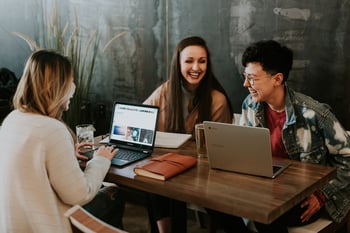 Three people working together with laptops-1