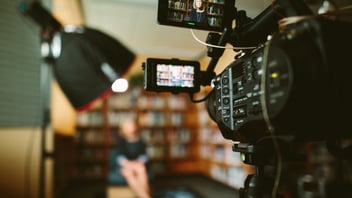 video recording a woman blurry in background